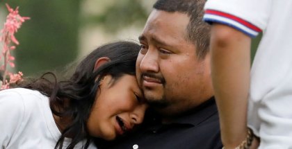 People react outside the Ssgt. Willie de Leon Civic Center in Uvalde, where students were transported from Robb Elementary School after a mass shooting on May 24, 2022.