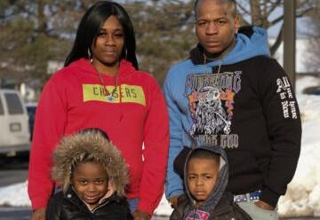 Brianna Hernandez, Jonathan King, their daughter, Zariyah, 5, and son Jonathan, 4, outside a hotel in Elgin, Ill., where they lived for a time after receiving an eviction notice.