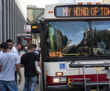 A CTA bus shuttle reads “My Kind of Town” as migrants disembarked a bus at Union Station after a 25-hour-long ride from Texas Sept. 9, 2022