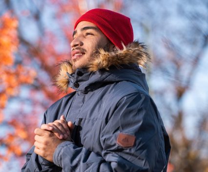Yorvi Sánchez warms his hands as he posed for a portrait in West Ridge on Nov. 1, 2022.