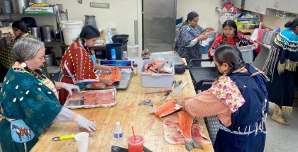 Lottie Sam, front right, and other women prepare salmon in Toppenish, Washington, before a ceremony held by the Confederated Tribes and Bands of the Yakama Nation.