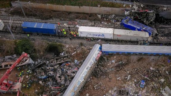 Rescue workers gather at the site of a train derailment in Greece