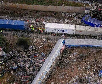 Rescue workers gather at the site of a train derailment in Greece