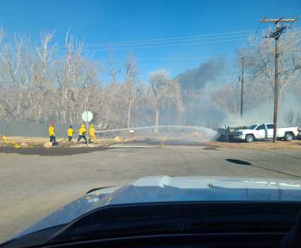 An early glimpse of firefighters trying to limit the spread of the Marshall Fire on the fire’s western side just east of Highway 93 on Marshall Road