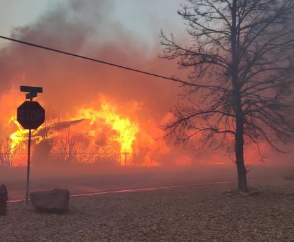 By late afternoon, homes continue to burn in sections of Boulder County. This home was located in Original Town Superior.