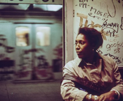 An African-American woman sits inside a subway car which has been marked with extensive graffiti, New York City, New York, 1973. Image courtesy National Archives. (Photo via Smith Collection/Gado/Getty Images).