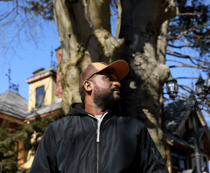 Edson DaSilva grew up on Monadnock Street in Uphams Corner and played baseball beneath the beech tree in neighbor Bob Haas’s yard. DaSilva is part of the DePina clan, a family of Cape Verdean immigrants who once owned houses up and down the street. Jessica Rinaldi/Globe Staff