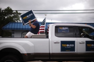 Lumbee Tribal Chairman John Lowery waves to supporters at a parade during the 2022 Lumbee Homecoming in Pembroke.