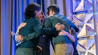 Journalists from Trint share a group hug after winning an OJA. (Photo: Violet Wang)