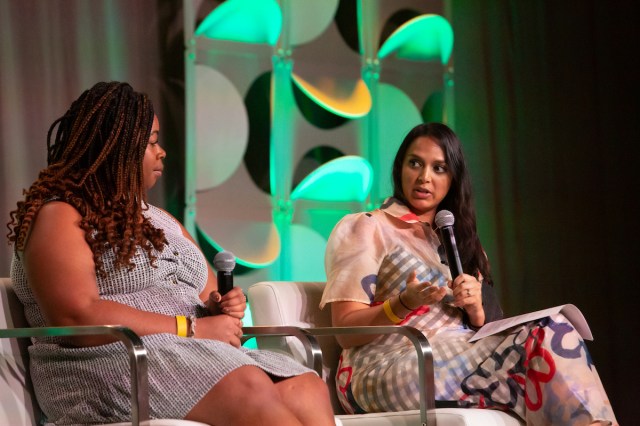 Lucia Priselac and Versha Sharma speak on stage at ONA22 in Los Angeles.