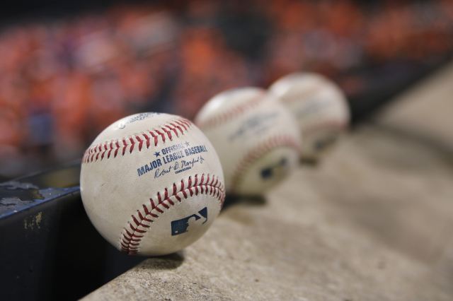 Three white baseballs